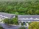 Aerial view of townhouses nestled in lush greenery at 2364 Silver Palm Dr, Kissimmee, FL 34747