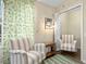 Sitting area with armchairs and small table at 2364 Silver Palm Dr, Kissimmee, FL 34747