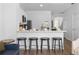 Open kitchen with breakfast bar and four modern barstools at 2364 Silver Palm Dr, Kissimmee, FL 34747