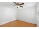 Bright bedroom with wood-look floors and ceiling fan at 1360 Landry Cir, Longwood, FL 32750