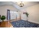 Sunlit dining area with hardwood floors, chandelier, and French doors at 1450 Ridgewood Ave, Maitland, FL 32751