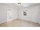 Bright bedroom with tile floors and access to a full bathroom at 2084 Old New York Ave, Deland, FL 32720