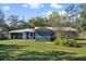 Cute blue house with a spacious backyard at 2084 Old New York Ave, Deland, FL 32720