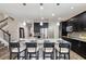 Eat-in kitchen with large island and seating for four at 5009 Torchwood Dr, Minneola, FL 34715