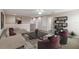 Spacious bonus room features a comfortable seating area, perfect for relaxation or entertainment at 5009 Torchwood Dr, Minneola, FL 34715