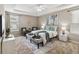 Spacious primary bedroom with ample natural light and sitting area at 5009 Torchwood Dr, Minneola, FL 34715