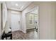 Bright and spacious entryway with wood-look tile floors at 5009 Torchwood Dr, Minneola, FL 34715