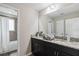 Modern bathroom with double vanity and granite countertop at 5009 Torchwood Dr, Minneola, FL 34715