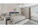 Relaxing bedroom with a king-size bed and stylish decor at 5009 Torchwood Dr, Minneola, FL 34715