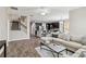 Open concept living space with a kitchen, staircase, and comfortable seating at 5009 Torchwood Dr, Minneola, FL 34715