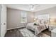 Bright bedroom with a queen-size bed and plenty of natural light at 5009 Torchwood Dr, Minneola, FL 34715