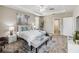 Bright bedroom with large bed and access to walk-in closet at 5009 Torchwood Dr, Minneola, FL 34715
