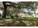 Home with a tire swing under a large oak tree at 202 Sweetwater Club Blvd, Longwood, FL 32779