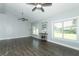 Large living room with hardwood floors and lots of natural light at 202 Sweetwater Club Blvd, Longwood, FL 32779