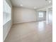 Light-filled living room with tile floors and window at 10411 Park Estate Avenue, Orlando, FL 32836