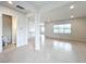 Open entryway with views of living room and half bathroom at 10411 Park Estate Avenue, Orlando, FL 32836