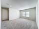 Large bedroom with neutral walls, carpet, and window at 10411 Park Estate Avenue, Orlando, FL 32836