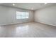 Bright and airy living room with tile floors and large window at 10411 Park Estate Avenue, Orlando, FL 32836