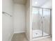 Shower with glass enclosure and neutral tile at 10411 Park Estate Avenue, Orlando, FL 32836