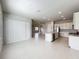 Open concept dining area with view into kitchen and Gathering room at 10411 Park Estate Avenue, Orlando, FL 32836