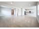 Open concept living room with kitchen and hallway access at 10411 Park Estate Avenue, Orlando, FL 32836