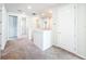 Upstairs hallway with neutral carpeting and doors to bedrooms at 10411 Park Estate Avenue, Orlando, FL 32836