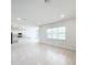 Bright living room with tile floors and kitchen view at 10411 Park Estate Avenue, Orlando, FL 32836
