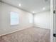 Spacious bedroom with neutral carpeting and two windows at 10411 Park Estate Avenue, Orlando, FL 32836