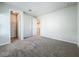 Spacious bedroom with neutral walls and carpeting, and walk-in closet at 10411 Park Estate Avenue, Orlando, FL 32836