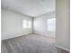 Spacious bedroom with neutral carpeting and multiple windows at 10411 Park Estate Avenue, Orlando, FL 32836
