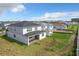 Two-story house with a backyard and covered patio at 10411 Park Estate Avenue, Orlando, FL 32836