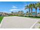 Sand volleyball court with surrounding landscaping at 8975 Candy Palm Rd, Kissimmee, FL 34747