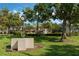 Community park with lush landscaping, clock, and fountain at 11542 Brightstowe Way, Orlando, FL 32836