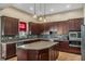 Modern kitchen with stainless steel appliances and an island at 11542 Brightstowe Way, Orlando, FL 32836