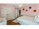 Cozy bedroom with a full-size bed and decorative wall art at 11542 Brightstowe Way, Orlando, FL 32836