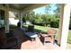 Relaxing back patio with seating area, brick flooring and view of the backyard at 11542 Brightstowe Way, Orlando, FL 32836
