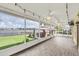 Enjoy lake views from this screened porch with tile floor and ceiling fan at 621 E Wildmere Ave, Longwood, FL 32750