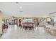 Spacious dining area with large table and chairs, open to kitchen and living areas at 621 E Wildmere Ave, Longwood, FL 32750