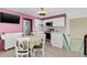 Eat-in kitchen with stainless steel appliances and light flooring at 621 E Wildmere Ave, Longwood, FL 32750