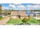 Lakefront home with two-car garage and landscaped yard at 621 E Wildmere Ave, Longwood, FL 32750