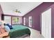 Spacious main bedroom with wood-look floors and a private balcony at 621 E Wildmere Ave, Longwood, FL 32750