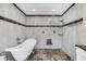 Elegant bathroom featuring a freestanding tub and walk-in shower at 621 E Wildmere Ave, Longwood, FL 32750