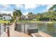 Lakefront dock with fire pit and seating area at 621 E Wildmere Ave, Longwood, FL 32750