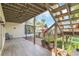 Covered lower deck with access to backyard and lake views at 621 E Wildmere Ave, Longwood, FL 32750