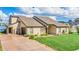 Lakefront home with two-car garage and landscaped yard at 621 E Wildmere Ave, Longwood, FL 32750
