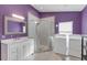 Bathroom with white vanity, shower, and laundry at 621 E Wildmere Ave, Longwood, FL 32750