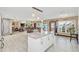 Modern kitchen with white cabinets, granite island, and stainless steel appliances at 621 E Wildmere Ave, Longwood, FL 32750