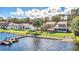 Aerial view of a lakefront house with a dock and large backyard at 621 E Wildmere Ave, Longwood, FL 32750