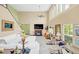 Bright and airy living room with a fireplace, large sectional sofa, and access to backyard at 621 E Wildmere Ave, Longwood, FL 32750