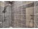 Large walk-in shower with dark gray tiles at 621 E Wildmere Ave, Longwood, FL 32750